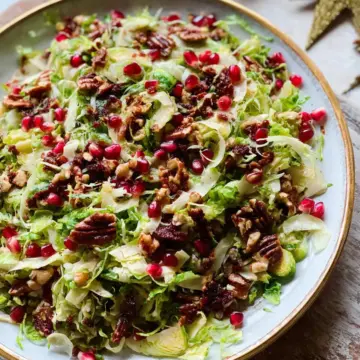 Shaved Brussels Sprout Salad with Pomegranate and Candied Pecans